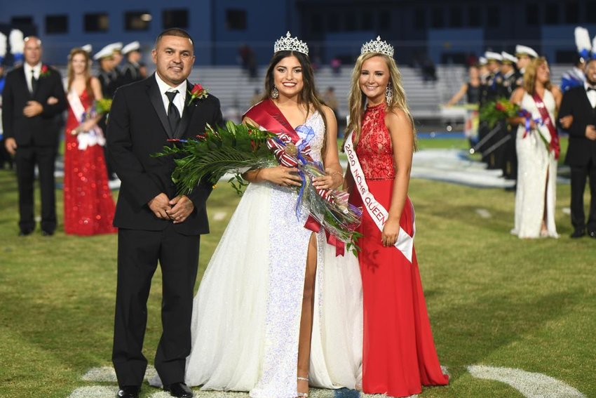 Tenly Grisham, center, was crowned Neshoba Central High School’s homecoming queen Oct. 1. She is pictured with her father, Jason Grisham, left, and Neshoba Central’s 2020 homecoming queen, Anna Cumberland.